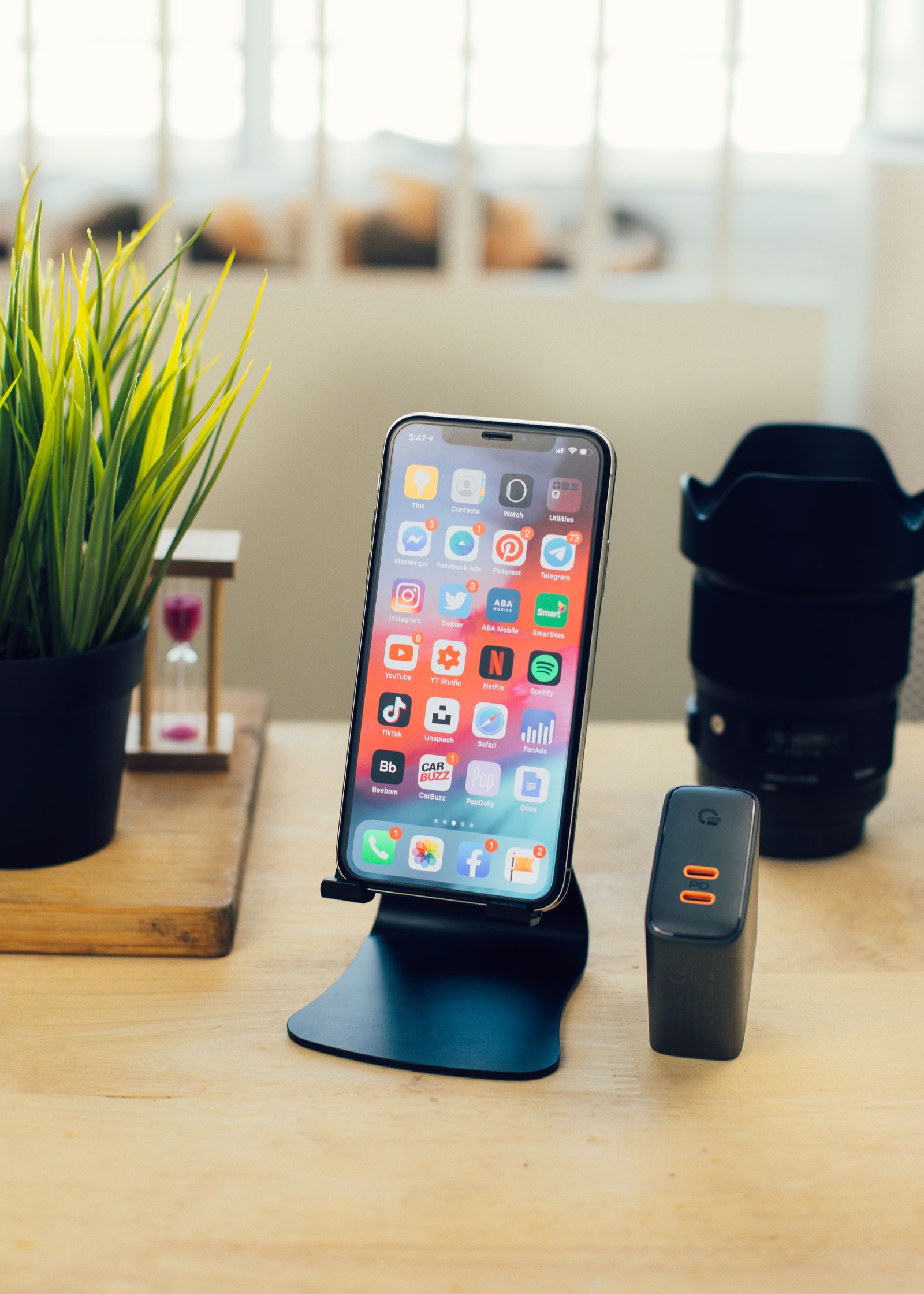 Smartphone and work tools on a desk